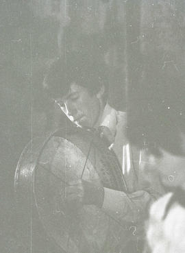 Unidentified musician playing bodhran [negative] / Joe Dowdall