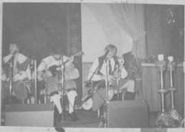 Unidentified men in costume with bouzouki and pipes [negative] / [unidentified photographer]