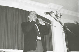 Luigi Lai playing pipes [negative] / Glenn Cumiskey