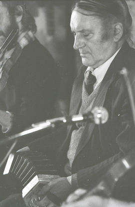 John Sr Kelly playing concertina [negative] / Joe Dowdall
