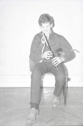 Unidentified musician playing pipes [negative] / [unidentified photographer]